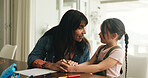 Homework, paper and mom with girl in home for lesson, learning and assessment or activity. Family, help and mother with child, document or education for studying or knowledge development in house