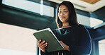 Woman, realtor and tablet in office for website, property management and service review. Low angle, estate agent and digital tech in agency for commission update, scroll and smile for research