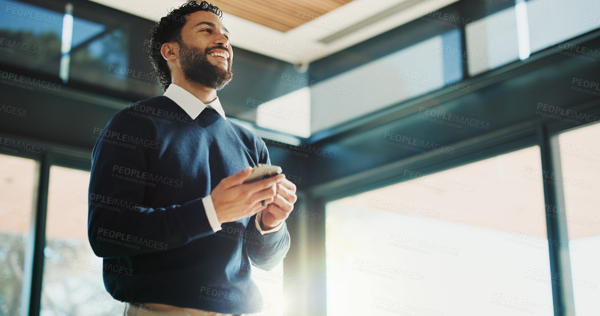 Buy stock photo Below, business and man with smartphone, smile and media agency with positive review. Happy person, low angle and journalist in office, cellphone and funny with internet, online publication or laugh