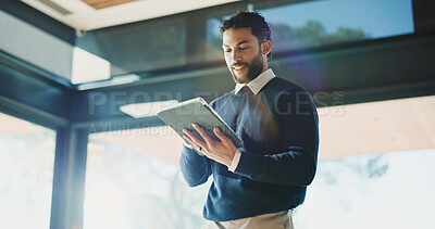 Buy stock photo Man, realtor and tablet in office for reading, property management and service review. Low angle, estate agent and digital tech in agency for commission update, scroll and smile for reflection