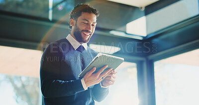 Buy stock photo Man, realtor and tablet in office for smile, property management and service review. Low angle, estate agent and digital tech in agency for commission update, app scroll and research for reading