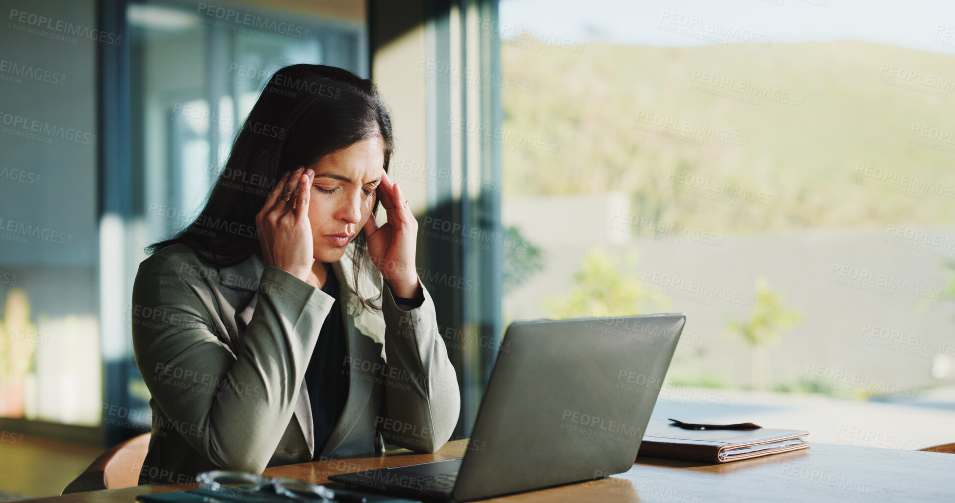 Buy stock photo Frustrated, business woman and headache with laptop, stress or overworked for pressure in office. Tired, female person or employee with migraine, fatigue or burnout for mental health in workplace