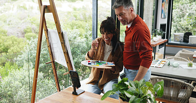 Buy stock photo Canvas, couple and painting with phone in home for art inspiration, creative activity and support. Artist, mature people and palette with smartphone for artwork reference, self expression and bonding