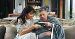Couple, help and herbal tea for illness on couch, smile and partner with flu symptoms, care and home. Happy, woman and mature man with allergies, marriage and healing with warm drink in living room