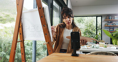 Buy stock photo Home, painter and woman with smartphone, influencer and live streaming with fans engagement. Online app, artist or mature person with canvas, cellphone or content creation with tips or showcase craft