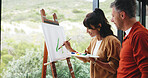 Easel, couple and painting at window in home for custom art project, creative activity and support. Happy artist, mature people and canvas on balcony for artwork hobby, nature inspiration and bonding