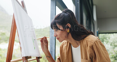 Buy stock photo Woman, painting and brush with canvas for art, creativity or imagination for development in home. Female person, artist or painter with paintbrush or frame for skill, talent or creative inspiration
