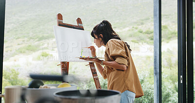 Buy stock photo Window, woman and painting on canvas in home for creative activity, artwork creation and hobby. Artist, back of person and easel on balcony for custom design, self expression and art on mockup space