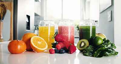 Buy stock photo Juice, range and glasses in kitchen with fruit for antioxidant, vitamin detox and mineral benefits. Orange, strawberry and kiwi drinks in home for digestive health, organic nutrition and  hydration.