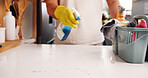 Spring cleaning, hands or container in kitchen with disinfectant, housework or sanitation of countertop. Space, chores or person in house with detergent, bacteria or germ removal in liquid spray.