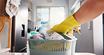 Spring cleaning, hand or container in kitchen with products, task or sanitation in home maintenance. Disinfection, chores or person in house with gloves, bacteria or germ removal in hygiene routine.