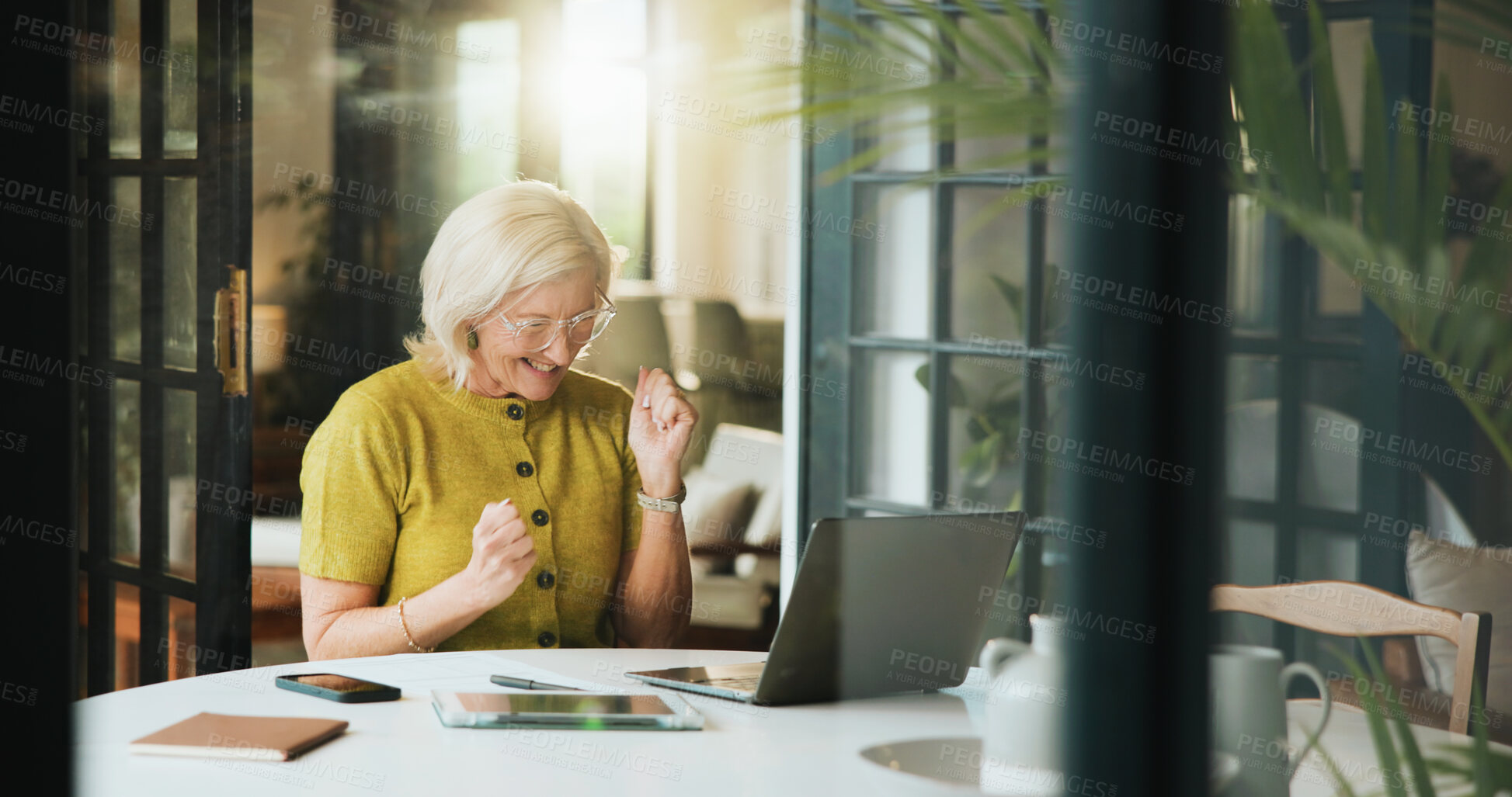 Buy stock photo Fist pump, laptop and success with mature woman in home for bonus, milestone or reward. Celebration, computer and remote work with excited freelance employee in apartment for good news as winner