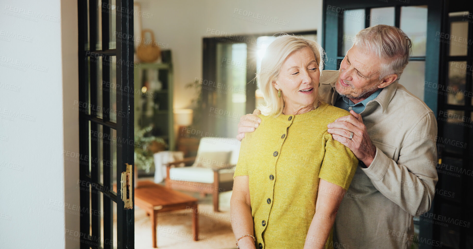 Buy stock photo Hug, care and love with old couple in home for support, retirement and talking. Marriage, conversation and happiness with senior man and woman in house for loyalty, commitment and trust together