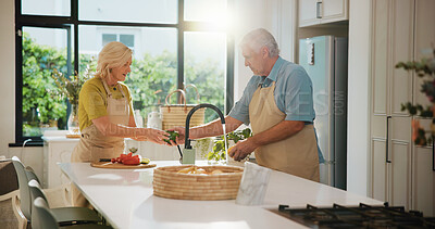 Buy stock photo Senior couple, rinse vegetables and kitchen with cleaning, recipe and helping hand for dinner at house. People, wash pepper and ingredients with cooking, diet and hygiene for nutrition in retirement