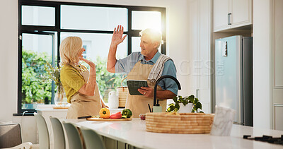 Buy stock photo Senior couple, high five and tablet for cooking in kitchen, recipe and excited for teamwork at house. People, vegetables and ingredients with tech, app or success for nutrition in retirement home