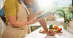 Senior, couple and hands with tablet in kitchen for online cooking tutorial or healthy recipe. Elderly, man and woman with technology or ingredients for research, natural organic food or meal prep