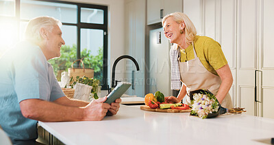 Buy stock photo Smile, flowers and cooking with old couple in kitchen of home for anniversary celebration, romance or tablet. Love, online recipe and bouquet with senior man and woman in house for date and meal prep