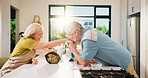Old couple, kiss hand and bouquet in kitchen for valentines day, anniversary and celebration at home. Senior people, happy and flare with flowers, loyalty and present for milestone in relationship