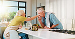 Old couple, kiss hand and flowers in kitchen for valentines day, anniversary and celebration at home. Senior people, happy and care with bouquet, loyalty and present for milestone in relationship