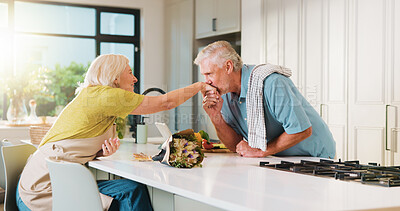 Buy stock photo Old couple, kiss hand and flowers in kitchen for valentines day, anniversary and celebration at home. Senior people, happy and care with bouquet, loyalty and present for milestone in relationship