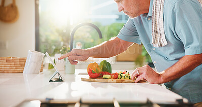 Buy stock photo Senior, man and online recipe with tablet for cooking tutorial or healthy food in kitchen. Elderly, male person or research with technology or ingredients for natural organic snack or meal prep