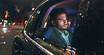 Serious, travel and businessman in car at night in city with technology for networking with email. Reading, research and male person checking project with deadline in vehicle with commute in town.