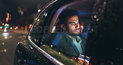 Buy stock photo Serious, travel and businessman in car at night in city with technology for networking with email. Reading, research and male person checking project with deadline in vehicle with commute in town.