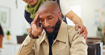 Buy stock photo Man, headache and team with stress at startup, frustrated and support with fatigue at office. Person, migraine and computer with staff, helping hand and burnout with deadline at creative agency