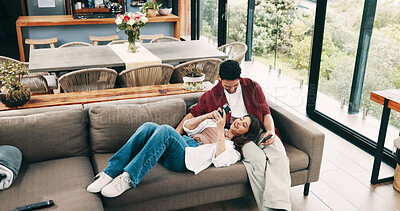 Buy stock photo Happy couple, relax and sofa with phone for network, connection or internet service in home. Top view, man or woman with smile, couch or mobile smartphone for social media, news or scrolling in house