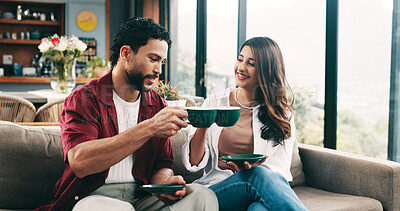 Buy stock photo Couple, cheers and people with coffee, lounge and happy with hot drinks in house, break and bonding. Toast, man and woman with warm beverages in living room, celebration or together on couch with tea