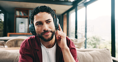 Buy stock photo Music, relax and thinking with man on sofa in living room of home for me time or wellness. Chilling, headphones and idea with person in apartment for easy morning, inspiration or weekend planning