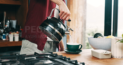 Buy stock photo Hand, pouring tea and steam with person in kitchen of home for beverage preparation at counter. Boiling water, cup and kettle with man closeup in apartment for drink, me time routine or wellness