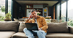 Remote work, laptop and man on sofa thinking for online article, research and proofreading. Freelancer, living room and mature person on computer for editing report, story ideas and planning in home