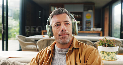 Buy stock photo Music, relax and thinking with man on sofa in living room of home for audio or sound streaming. Break, headphones and idea with mature person in apartment for inspiration, playlist or wellness