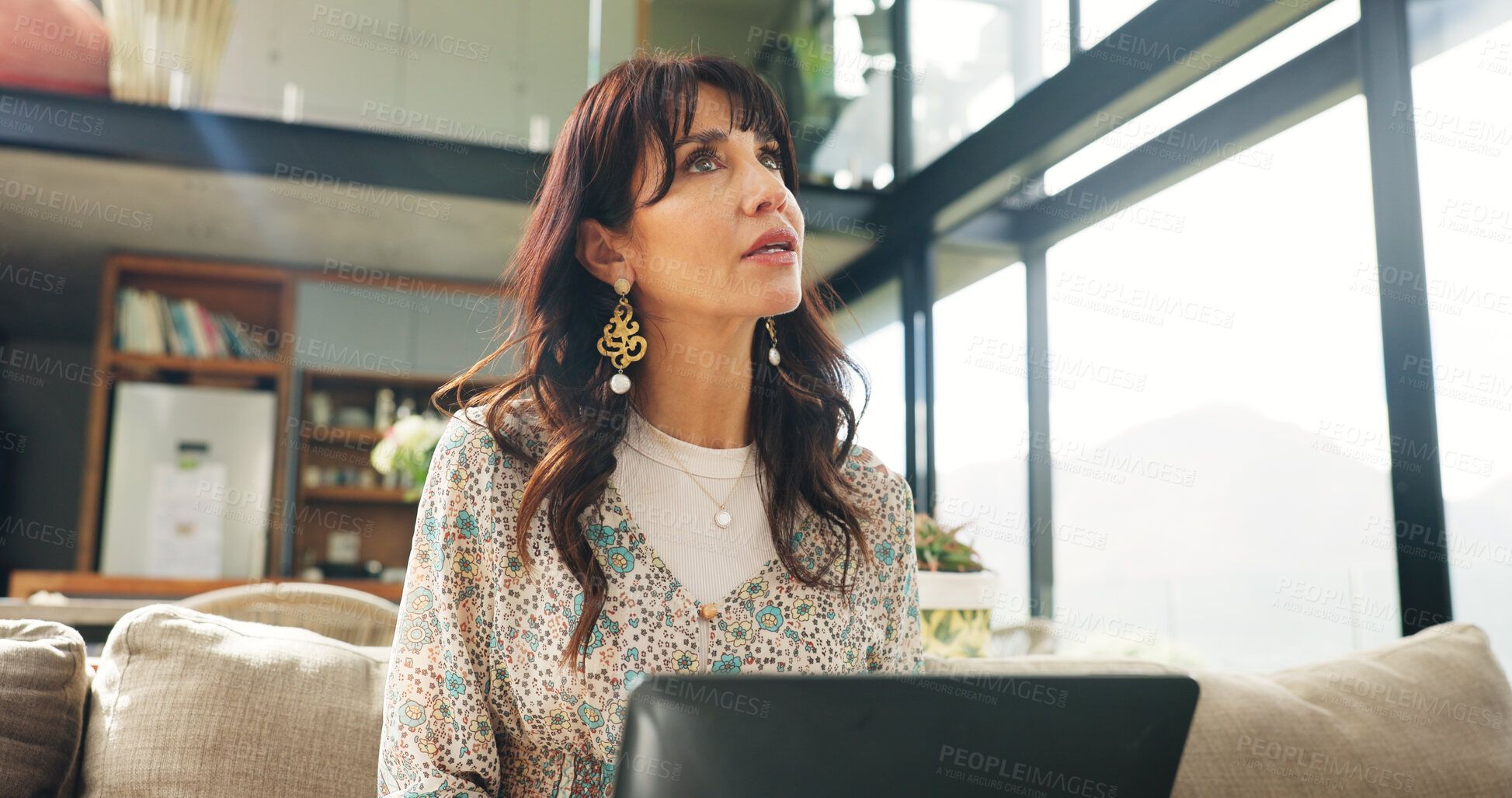 Buy stock photo Laptop, research and thinking with mature woman on sofa in living room of home for vacation planning. Computer, idea and travel itinerary with person in apartment for online booking of accommodation