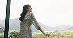 Below, woman and thinking on balcony at hotel for travel, scenic view and fresh air on holiday. Female person, vision or reflection and breathing on terrace, nature greenery and mountain on vacation