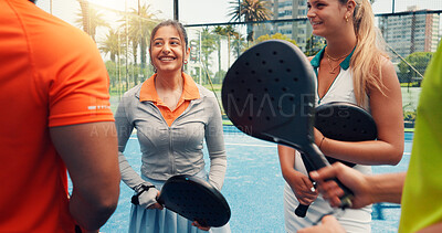 Buy stock photo Padel, friends and happy with talking on court for sports break, tournament practice and game advice. People, tennis team and chat at fitness club with match planning, friendly discussion and workout