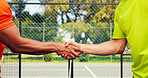 Men, handshake and padel with court for game start, match or beginning outdoor competition. Closeup, male people or athletic players shaking hands for sport tournament, challenge or training on turf