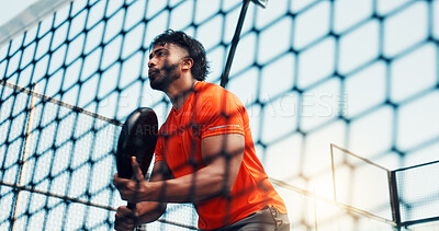Buy stock photo Padel game, net and man for fitness, training and outdoor performance. Tennis court, cardio and workout or club competition with person in match for athlete, exercise and low angle of tournament