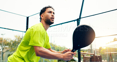 Buy stock photo Padel, serve and training with man on court for sports athlete, contest and tournament club. Low angle, competition and tennis player or person on outdoor turf for exercise, game and match challenge