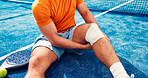 Padel, knee pain and legs of man with bandage for accident, injury or medical crisis on court. Sports, tennis and person with inflammation, hurt and sprain for training, exercise and fitness practice