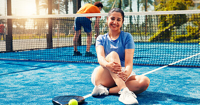 Buy stock photo Outdoor, padel and woman with smile, portrait and confident with sportswear, training or competition. Court, athlete and person on turf, wellness and tennis player with pride for match preparation