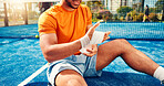 Padel, wrist pain and man with bandage for injury, accident and medical crisis on court. Sports, tennis and person with inflammation, hurt and sprain for training, exercise and fitness practice