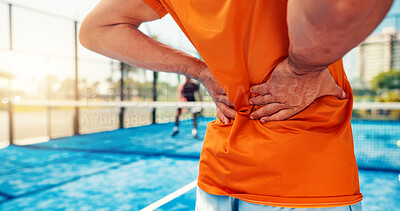 Buy stock photo Hands, person and back pain on tennis court for fitness, match accident and muscle sprain. Player, discomfort and joint strain of exercise mistake, inflammation and sports injury from tournament game