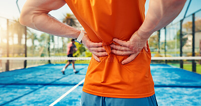 Buy stock photo Hands, person and back pain on tennis court from fitness, match accident and muscle sprain. Player, discomfort and joint strain for exercise mistake, inflammation and sports injury of tournament game