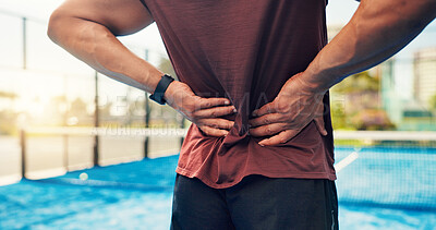 Buy stock photo Hands, person and back pain on tennis court from fitness, match accident and muscle sprain. Player, discomfort and joint strain of exercise mistake, inflammation or sports injury from tournament game