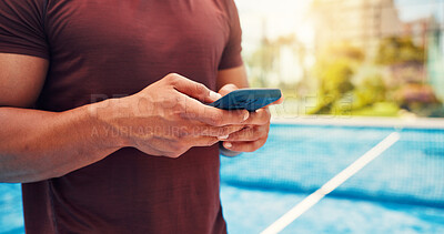 Buy stock photo Fitness, typing and hands on tennis court with phone, match schedule and social media update on rest. Sport, man and athlete outdoor with tech, wellness chat and virtual tutorial on training break.