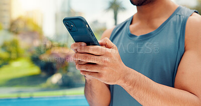 Buy stock photo Hands, athlete and man with phone on tennis court with fitness app, training tips and track progress. Person, mobile and reservation for padel, technique and video demonstration for sports tournament