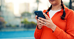 Hands, person and reading with phone on tennis court with fitness app, training tips and track progress. Woman, mobile and reservation for padel, technique and video demonstration of tournament match