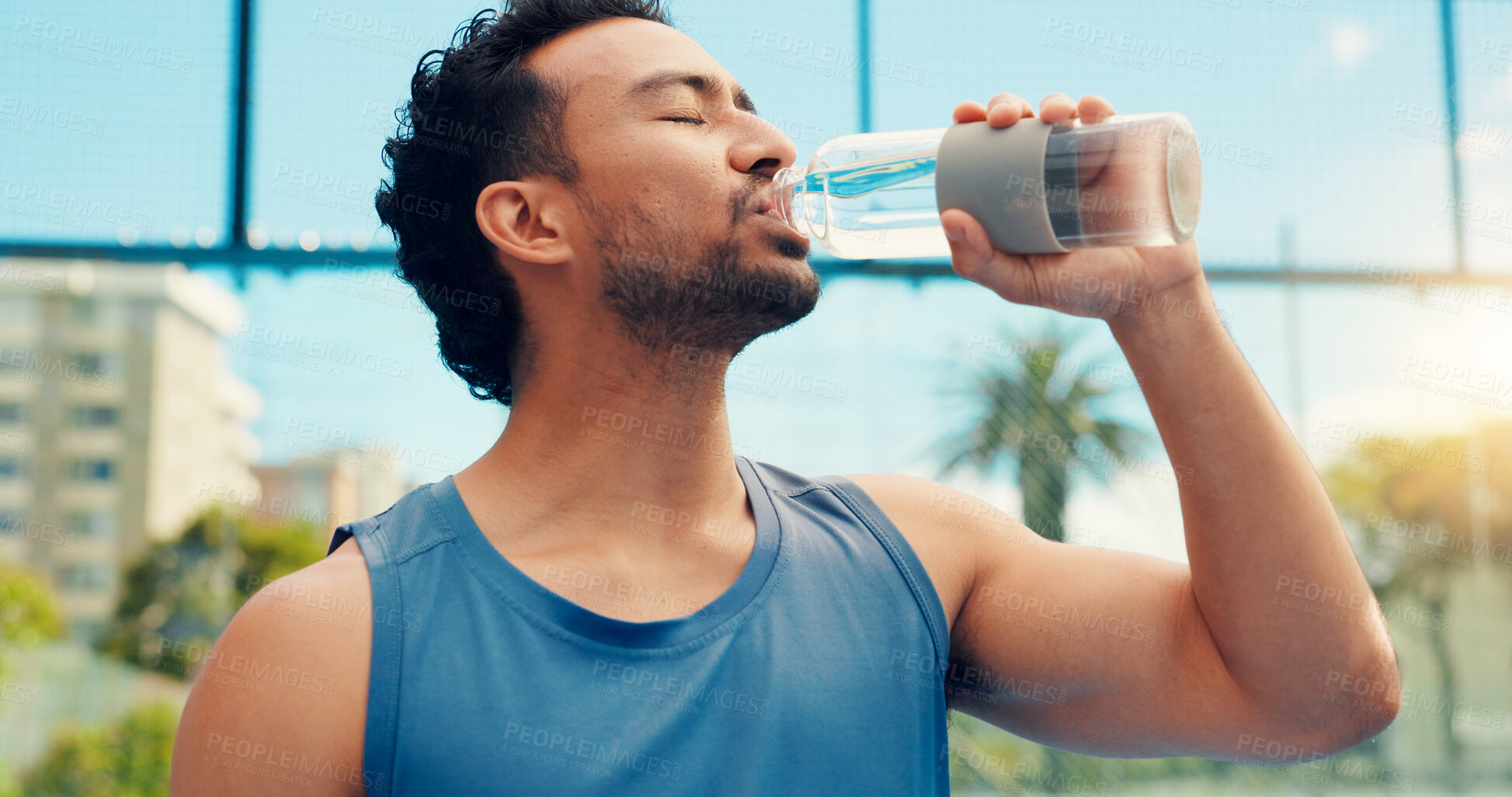 Buy stock photo Tennis player, man outdoor or drinking water with bottle, sports hydration or competition break. Active, thirsty person or athlete on court with beverage for electrolytes, tournament rest or recovery
